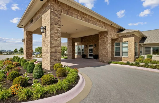 A brick building with a large archway and a lamp post. The building has a brick facade and a large archway. The building is located on a street corner. AI generated content