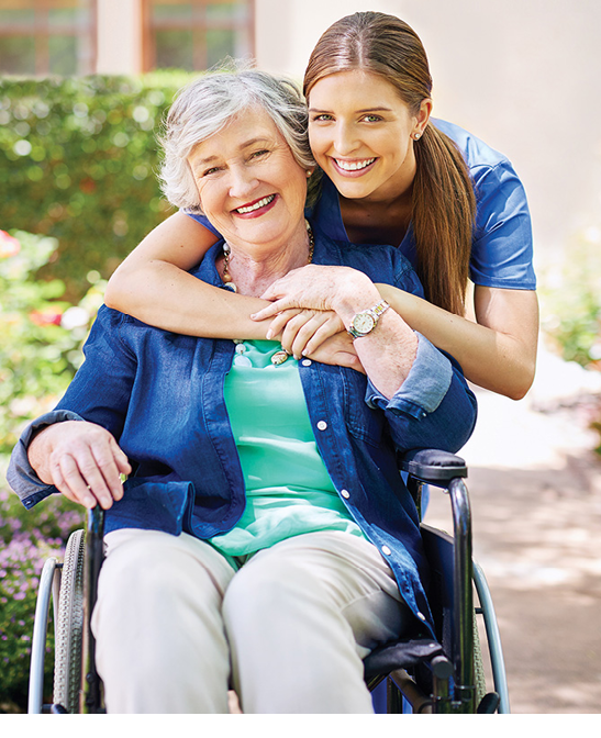 Shot of a resident and a nurse outside in the retirement home garden